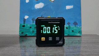 An inclinometer being tilted and showing the angle to the horizon